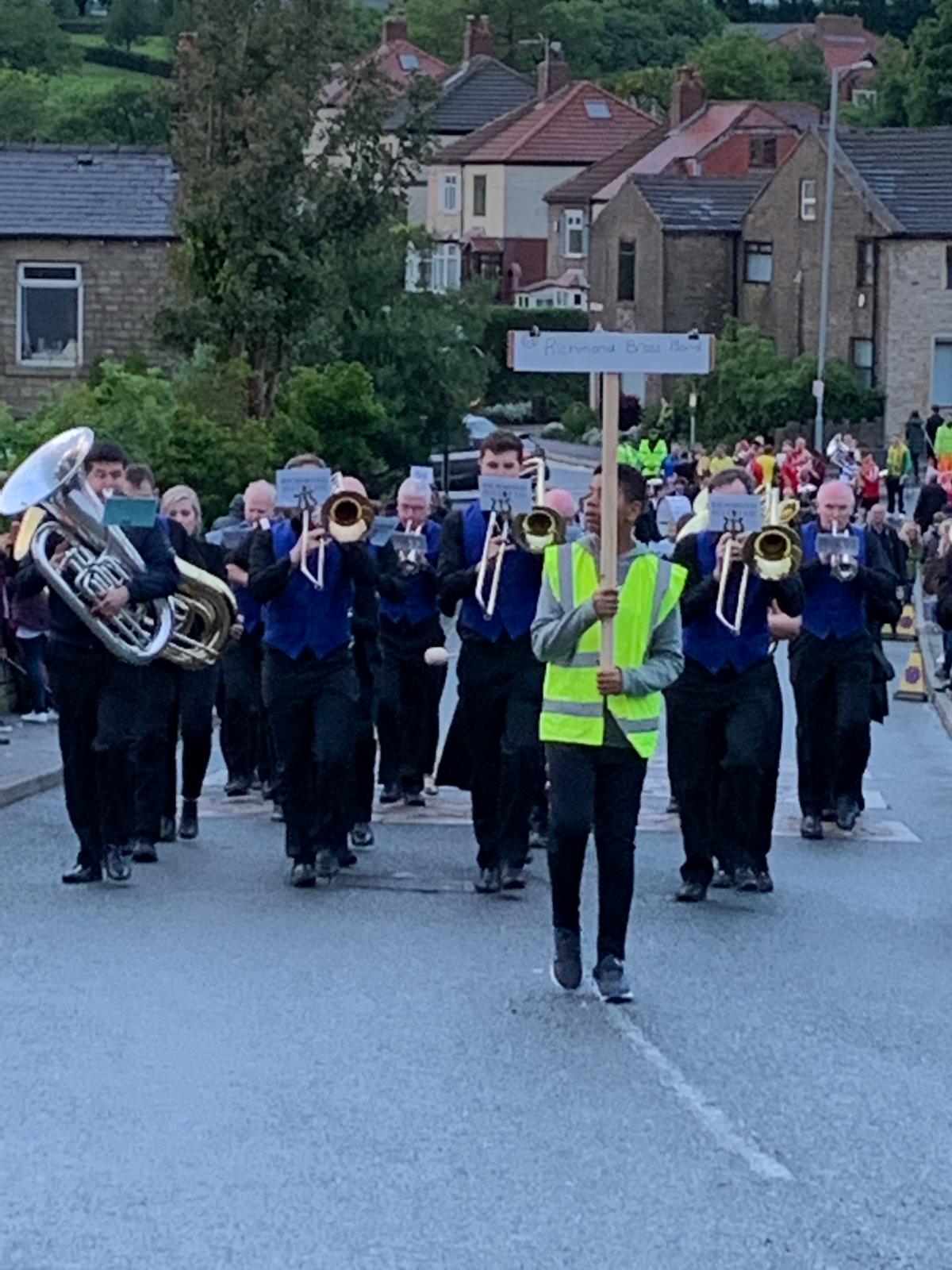 Richmond Brass Band marching up the hill at Lydgate