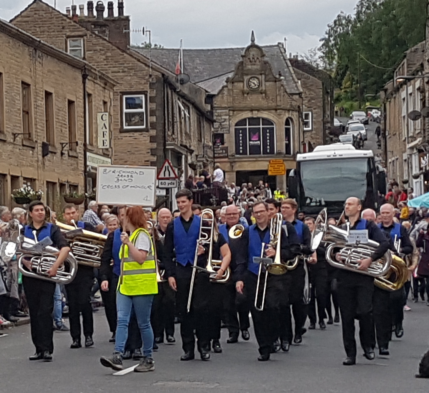 Richmond Brass Band marching through Delph